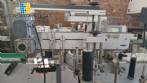 Etiquetadora autom�tica de doble cabezal para botellas planas Bauch Campos