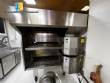Horno transportador Lincoln de acero inoxidable para hornear galletas y pizza.