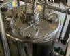 Llenadora rotativa gravim�trica de acero inoxidable con cabina