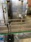 Llenadora rotativa gravim�trica de acero inoxidable con cabina