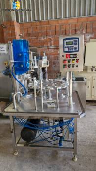 M�quina rotativa de acero inoxidable para llenado, dosificaci�n y sellado, con junta de aluminio, para tarros, vasos y botellas Delgo.