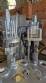 M�quina rotativa de acero inoxidable para llenado, dosificaci�n y sellado, con junta de aluminio, para tarros, vasos y botellas Delgo.
